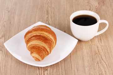 Classical breakfast. Coffee and croissant