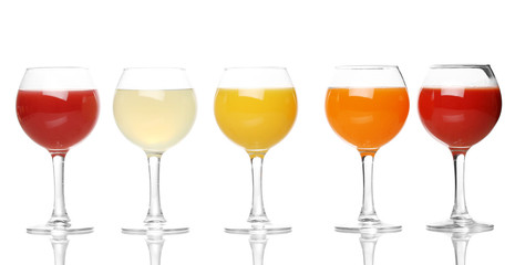 Tropical juices in glasses isolated on white