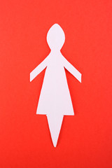 Obraz premium Paper woman on red background