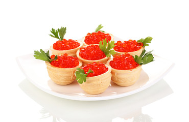Red caviar in tartlets on white plate isolated on white