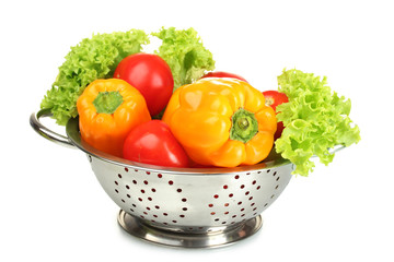 fresh vegetables in silver colander isolated on white