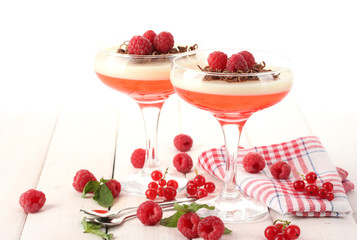 fruit jelly with berries in glasses on wooden table