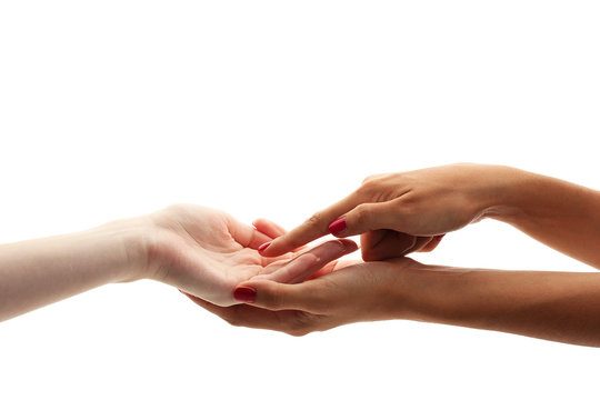 reading the lines hand in a woman's hands isolated on white