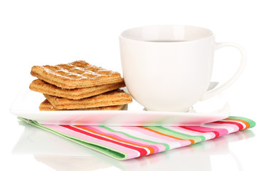 Cup of tea and cookies isolated on white