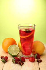 Refreshing sangria in glass with fruits,
