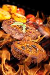 Delicious beef steaks on grill
