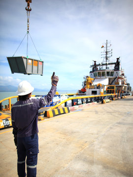 Harbor worker - watching the loading operation