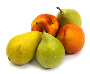Two nectarines and three pears on a white