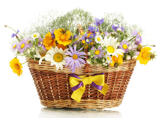 beautiful bouquet of bright  wildflowers in basket, isolated