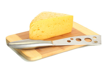 tasty cheese and knife on wooden cutting board isolated on