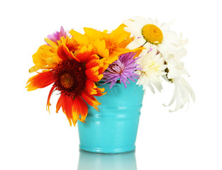 beautiful bouquet of bright  wildflowers in blue metal bucket,