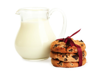 jar of milk and chocolate chips cookies with red ribbon