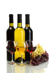 Obraz premium bottles and glasses of wine and ripe grapes isolated on white