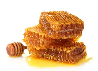 sweet honeycomb and wooden drizzler, isolated on white