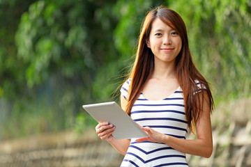 Fototapeta premium young woman using tablet touch computer