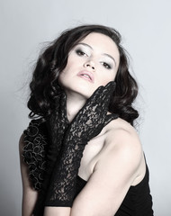 Fashion portrait of a young beautiful dark-haired