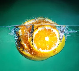 Foto op Canvas sinaasappel in water © Ievgen Skrypko
