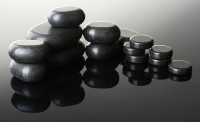 Spa stones on grey background