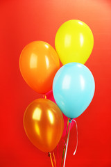 colorful balloons on red background