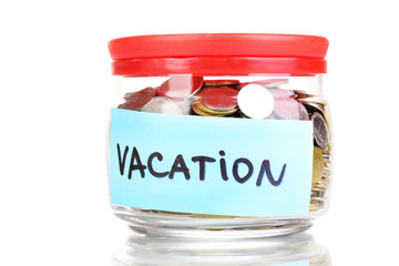 Glass bank for tips with money isolated on white