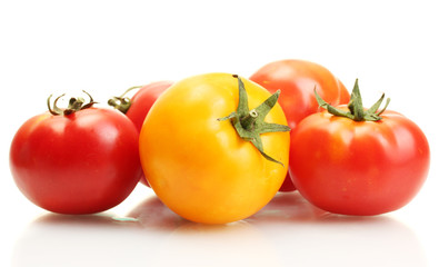 red and yellow tomatoes isolated on white