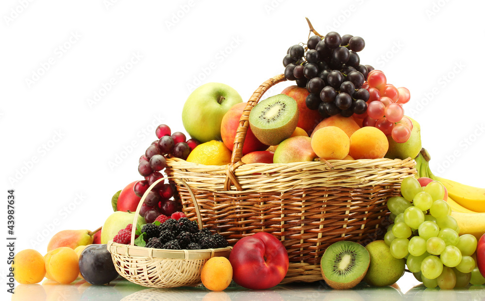 Wall mural Assortment of exotic fruits and berries in baskets isolated