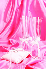 Wedding accessories on pink cloth background