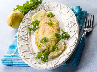 breaded sole fish with parsley and lemon
