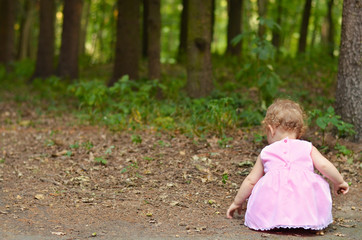 Baby girl in the forest