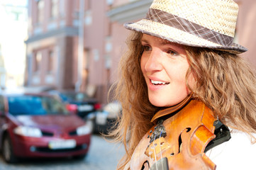 Woman playing violin on the street