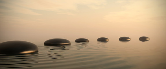 Zen path of stones on sunrise in widescreen