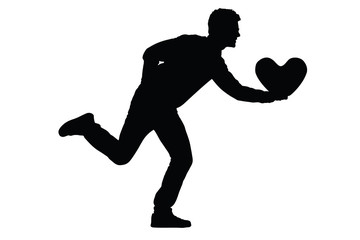 Silhouette of a young man running with a heart shaped pillow