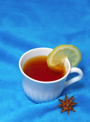 hot tea with lemon on a fur background