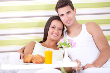 Obraz na płótnie Canvas couple enjoy in breakfast in bed