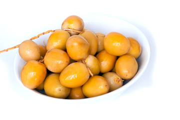 Fresh date in  a white bowl