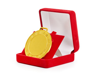 Golden medal in red gift box.