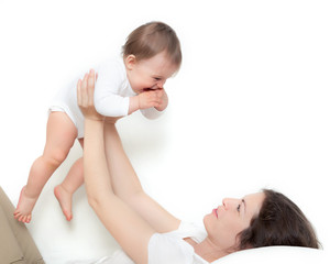 Obraz na płótnie Canvas Mother playing with baby