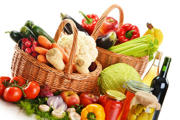 Wicker basket and grocery isolated on white