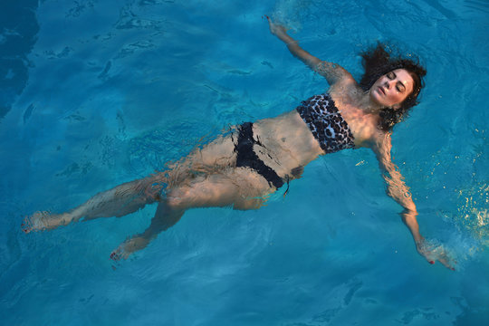 Woman With a Swimming Pool During Summer