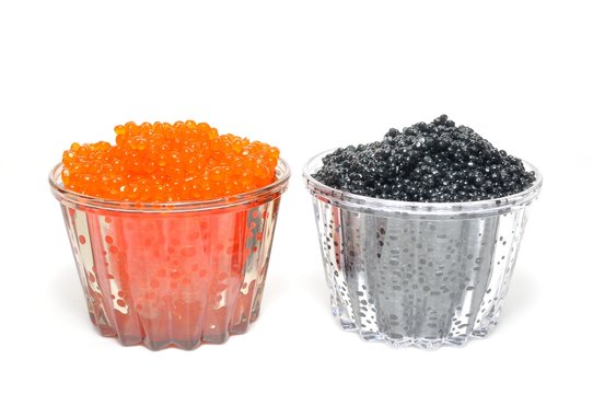 Red and black caviar on a white background