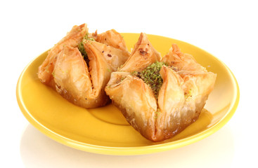 Sweet baklava on plate isolated on white