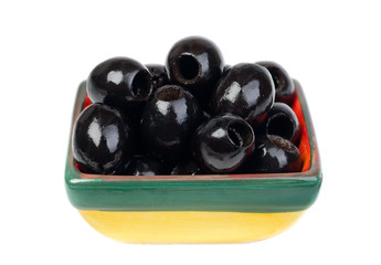 Black pitted olives in colored ceramic ware isolated  on  white