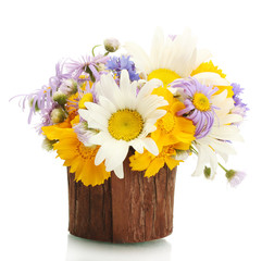 beautiful bouquet of bright  wildflowers in wooden flowerpot,