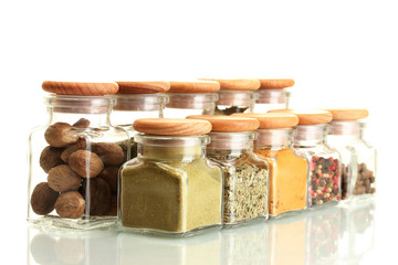 powder spices in glass jars  isolated on white
