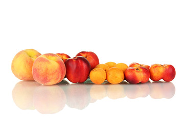 Ripe nectarines, apricots and peaches isolated on white