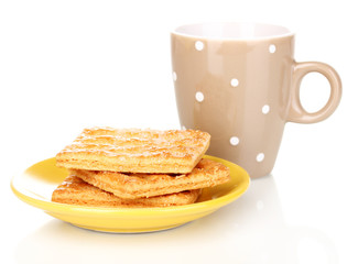 Cup of tea and cookies isolated on white
