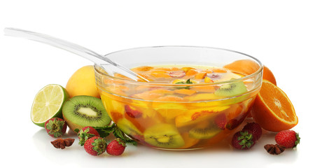 punch in glass bowl with fruits, isolated on white