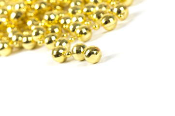 Background made of a brilliant celebratory beads of golden color