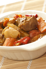 Delicious pork curry with squid on bamboo mat