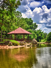 Wooden pavilion over a lake on a beautiful  japanese garden